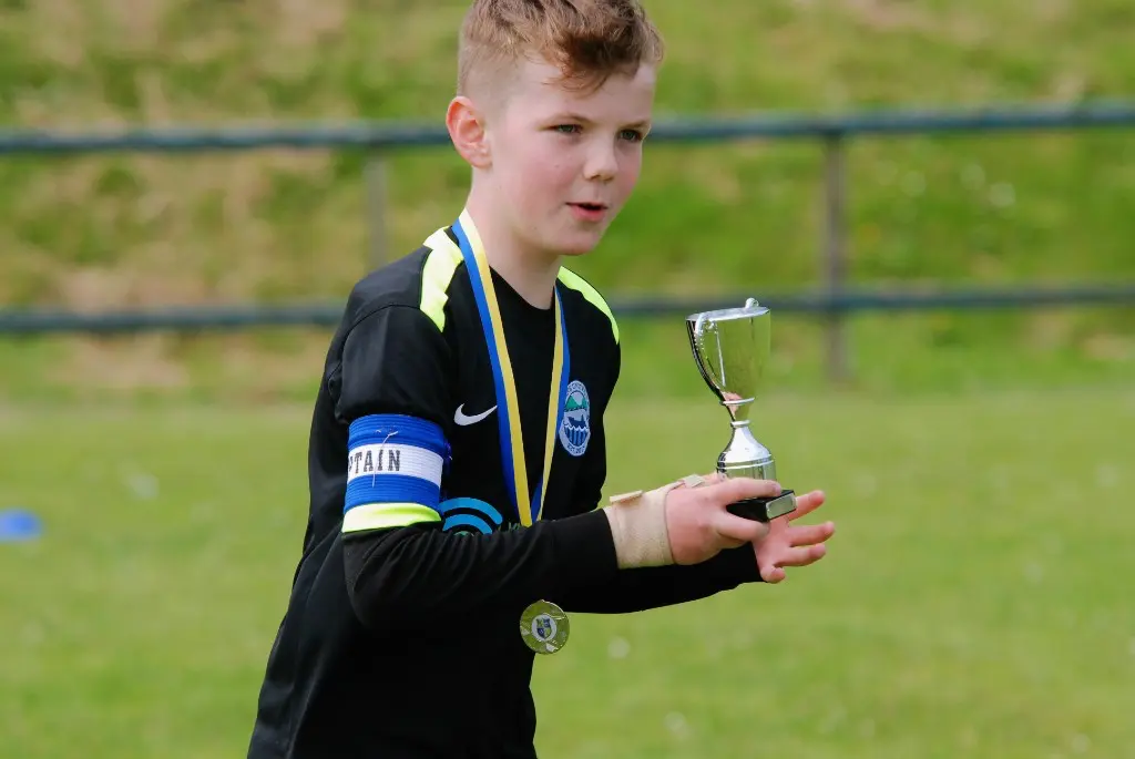 Player with trophy and medal