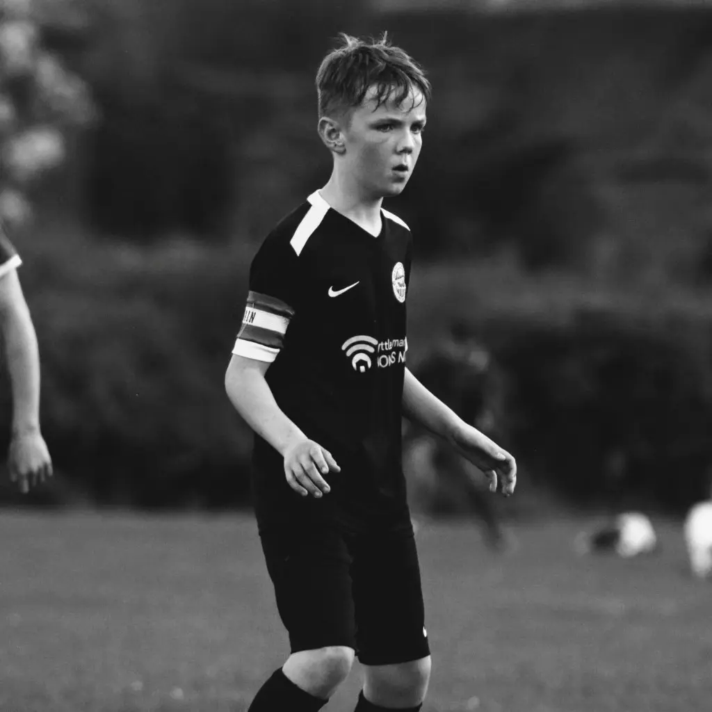 Monochrome photo of a Glens United captain